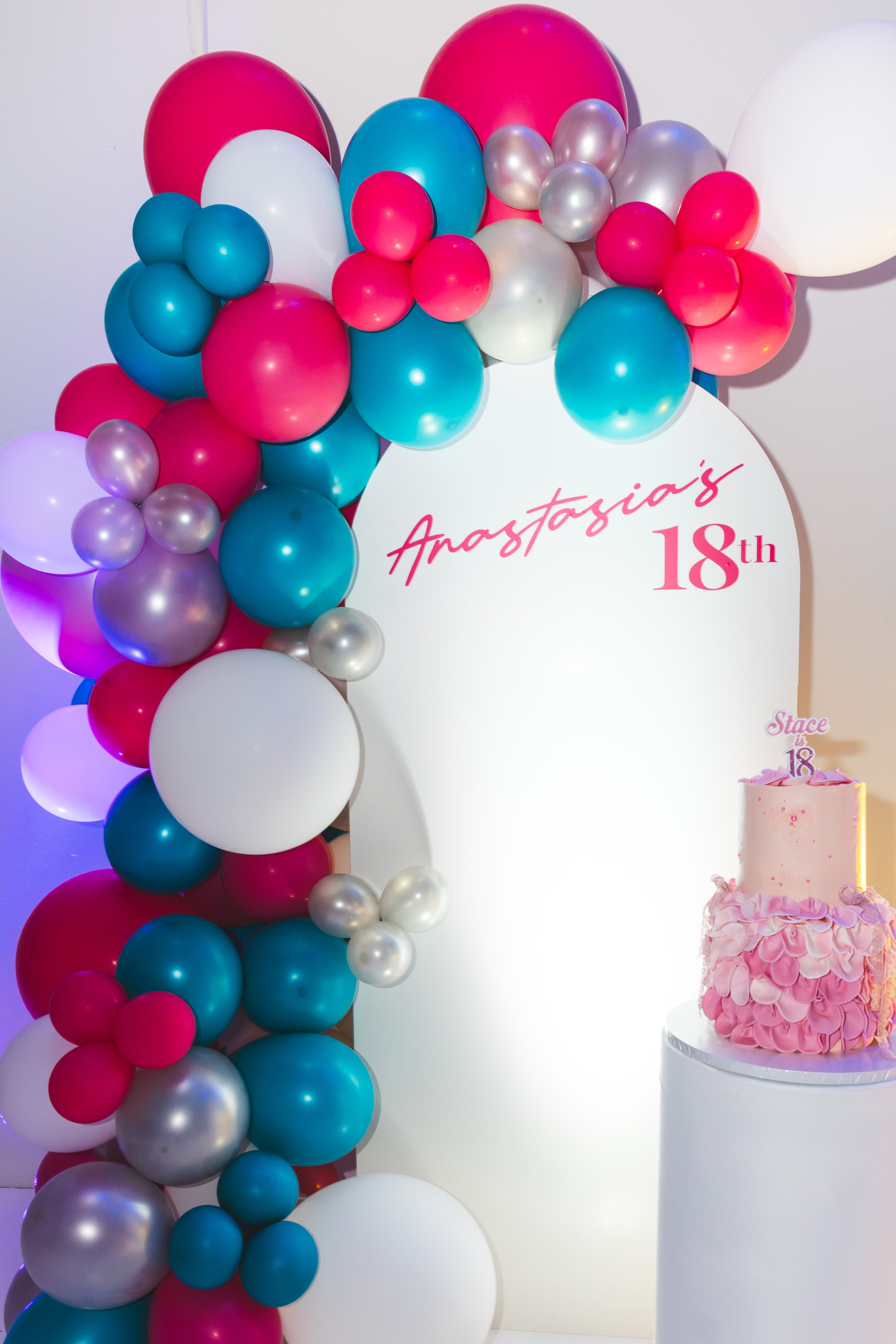 Elegant balloon arch and cake table setup at BBH Event Space